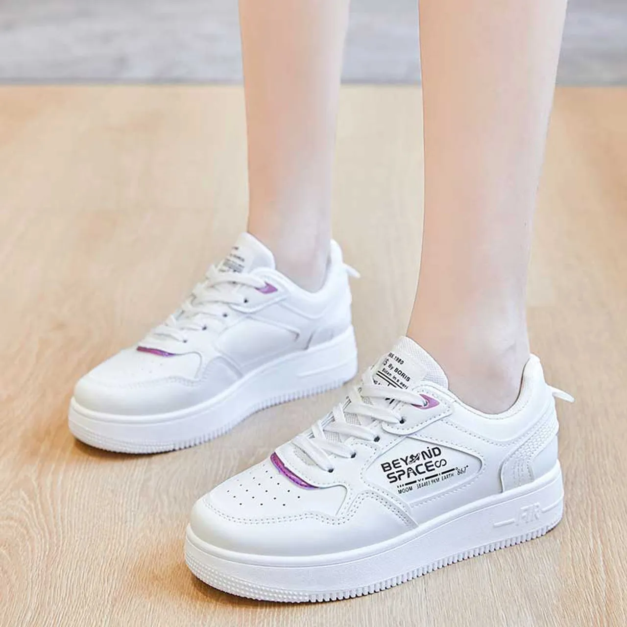 White sneaker with letter print.